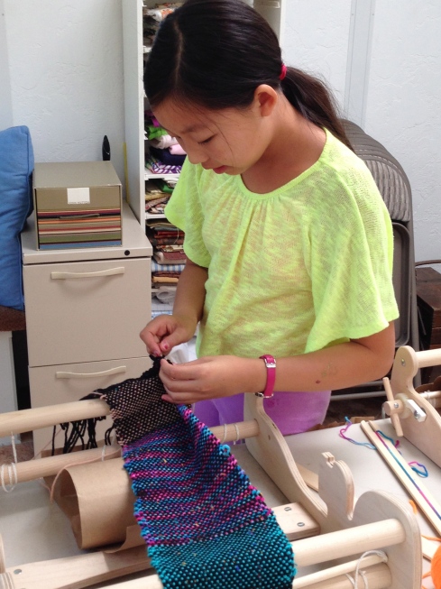 6th grader finishing her scarf.